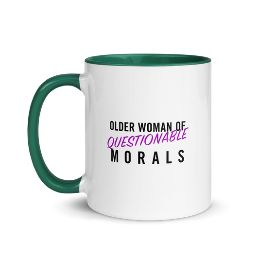 White ceramic cup with colored rim and handle. The text "older woman of questionable morals" on one side.