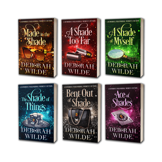 Paperback covers of books 2-7 in the "Magic After Midlife" series by Deborah Wilde. Books included are "Made in the Shade", "A Shade Too Far", "A Shade of Myself", "The Shade of Things", "Bent out of Shade", and "Ace of Shades".
