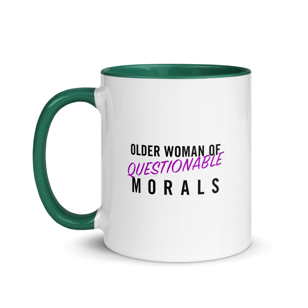 White ceramic cup with colored rim and handle. The text "older woman of questionable morals" on one side.